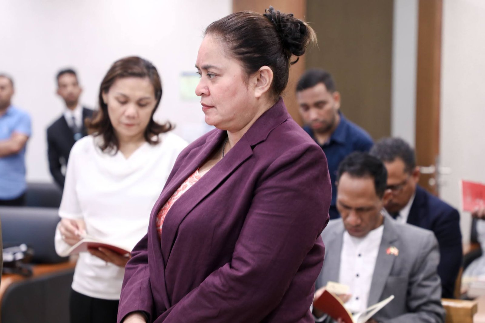 Delegation member in prayer
